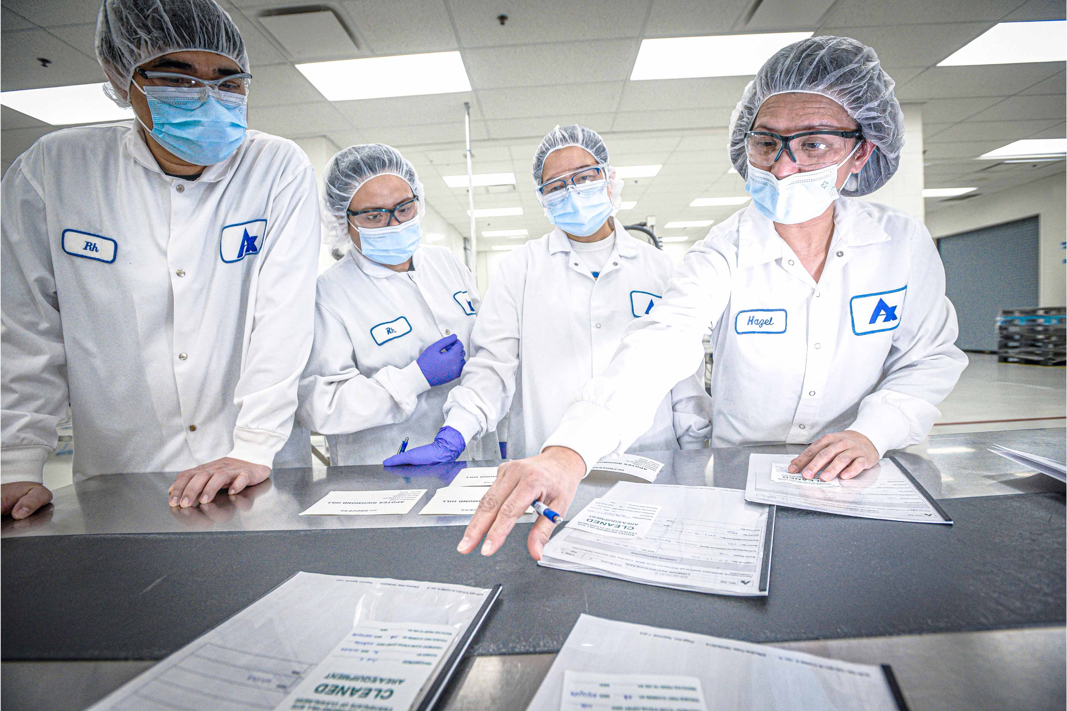 Apotex employees reviewing reports