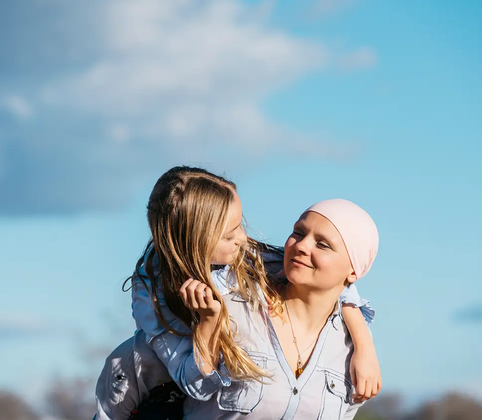 Cancer patient and friend looking at each other