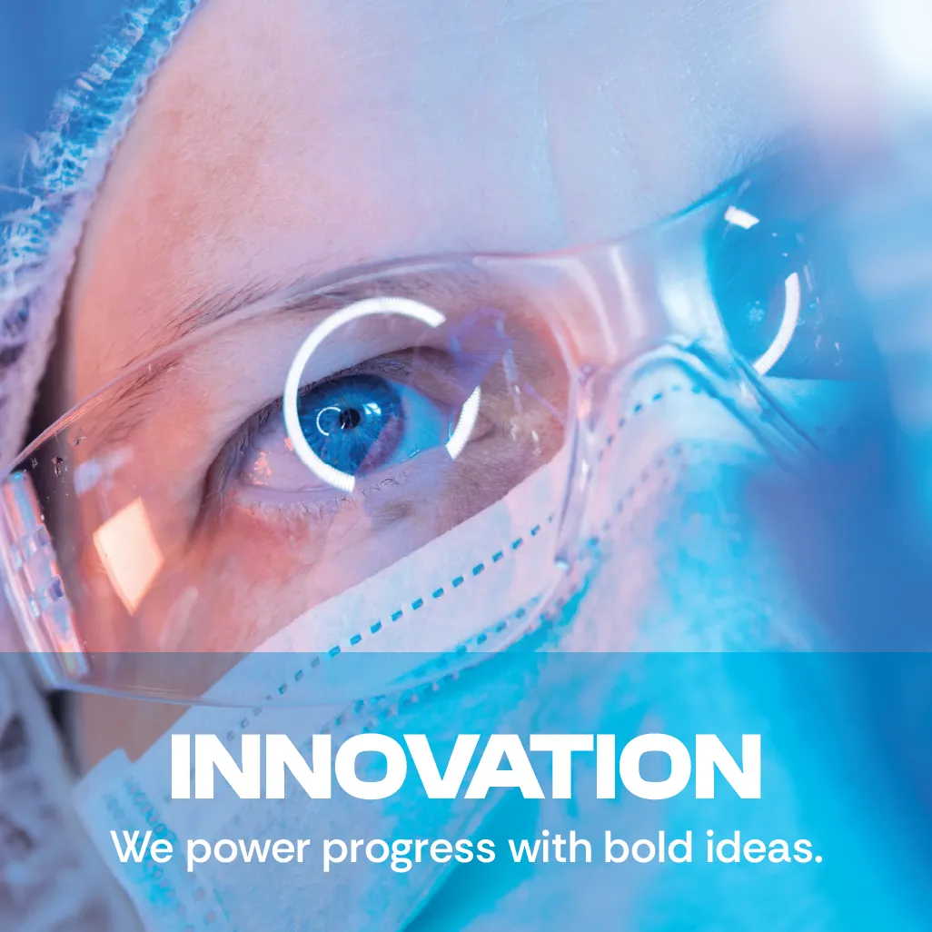 Innovation. We power progress with bold ideas. A close-up photo showing a scientist wearing protective glasses. Innovation. We power progress with bold ideas. A close-up photo showing a scientist wearing protective glasses.