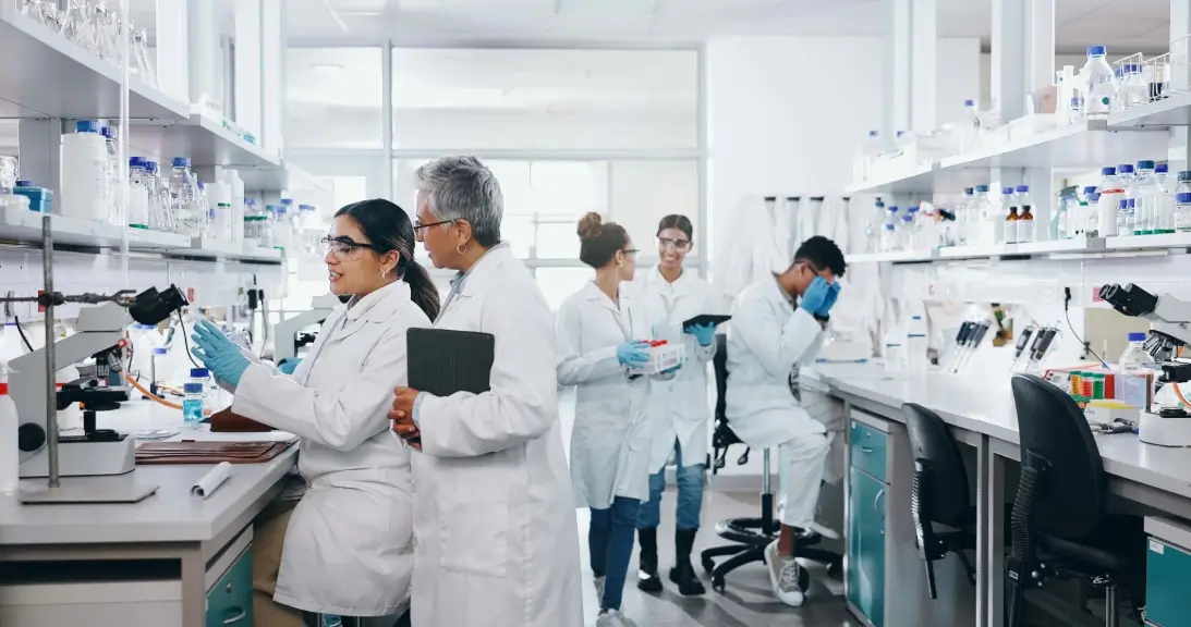 A laboratory with multiple scientists working at different stations.